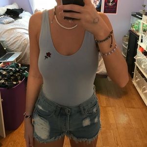 Blue body suit with rose detailing